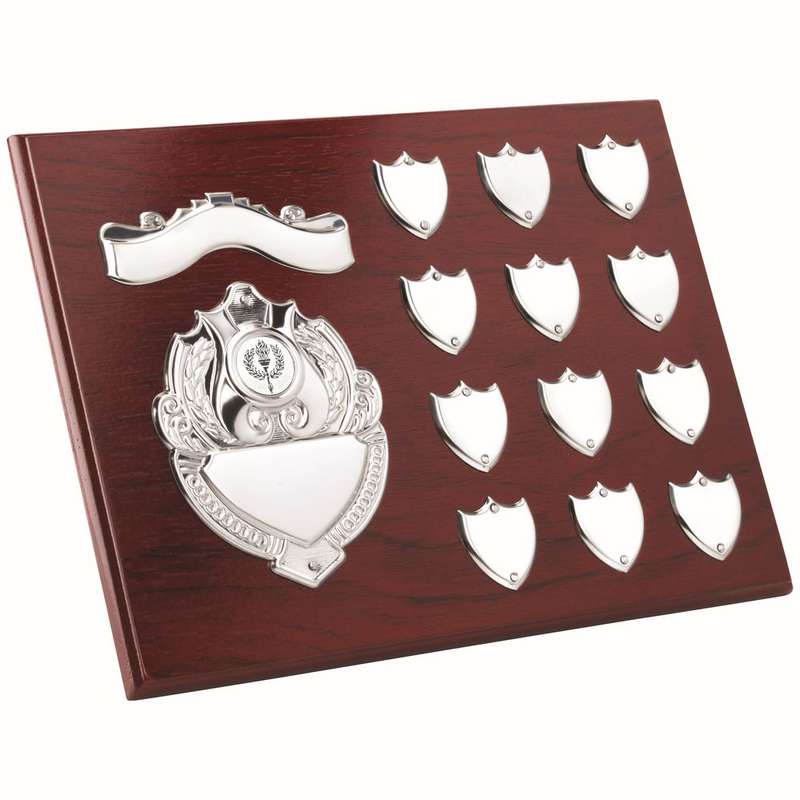ROSEWOOD PLAQUE WITH CHROME FRONTS AND 12 RECORD SHIELDS (1in CEN) – 9 x 12in
